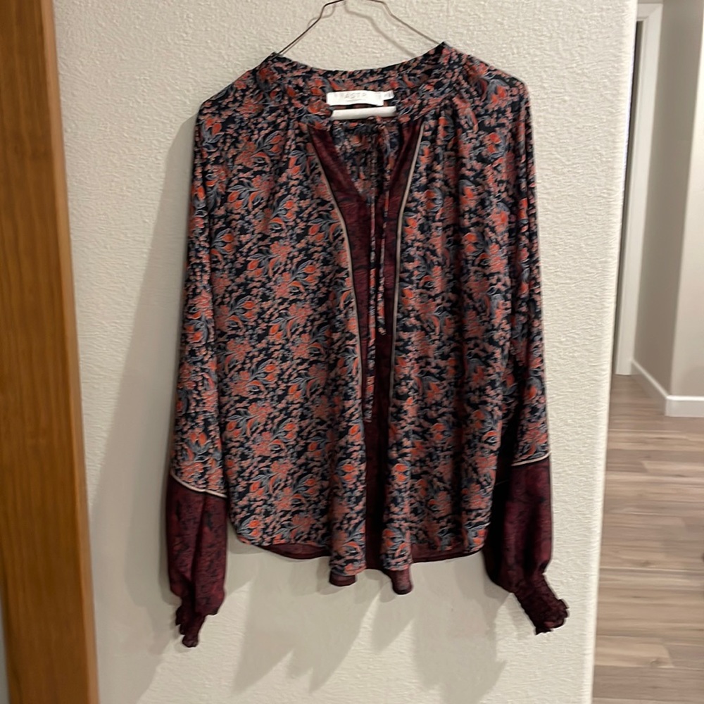Leightweight long sleeve blouse. Can be worn at work or church in summer.
